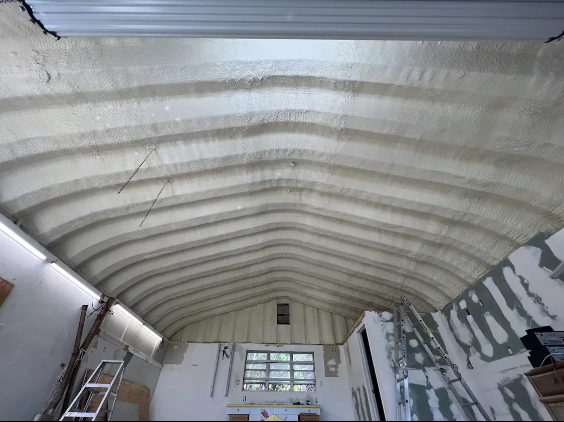 Spray polyurethane foam applied to the underside of a metal roof deck in Swartz Creek